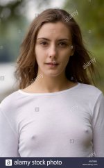 a-young-woman-outdoors-wearing-a-white-t-shirt-and-a-magenta-bikini-AM79MX.jpg