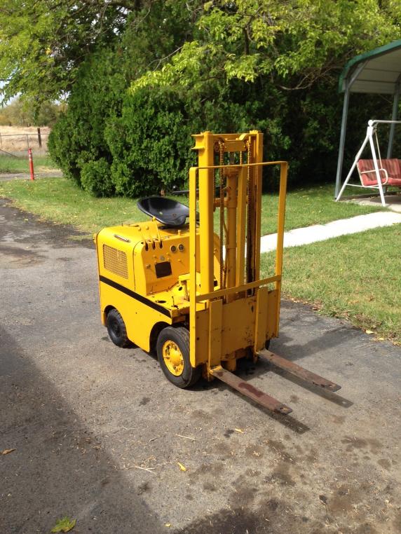 Tiny Clark 1000 pound ride on gas powered pneumatic tire fork lift